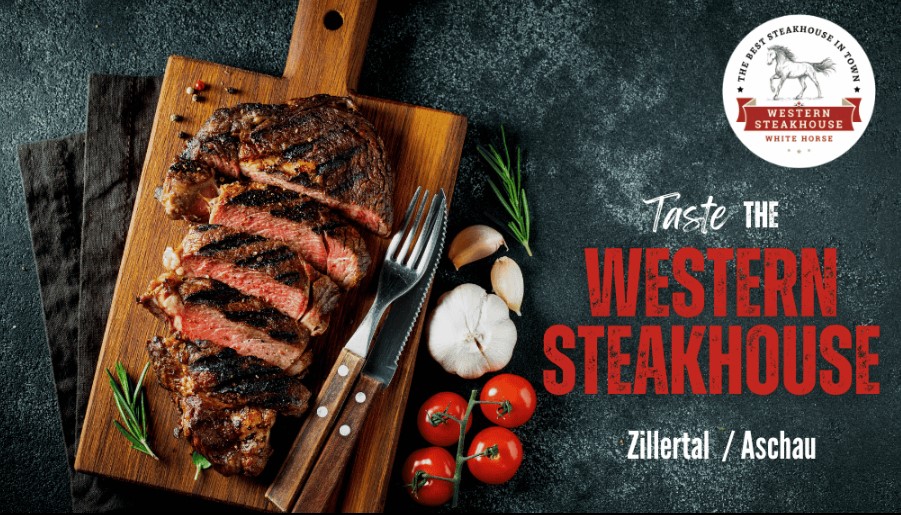 Gegrilltes Steak auf einem Holzbrett mit Kräutern und Tomaten, Western Steakhouse Zillertal Aschau